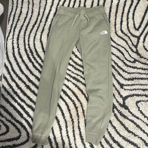 Green women’s north face sweatpants.